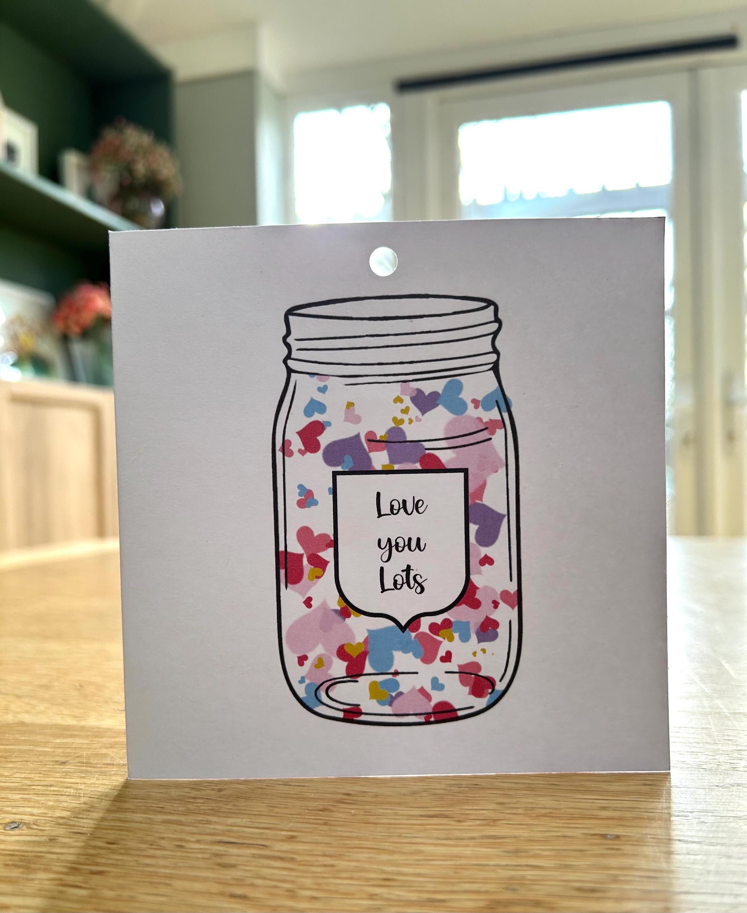 Greetings card with glass ornament with Jar of Hearts design